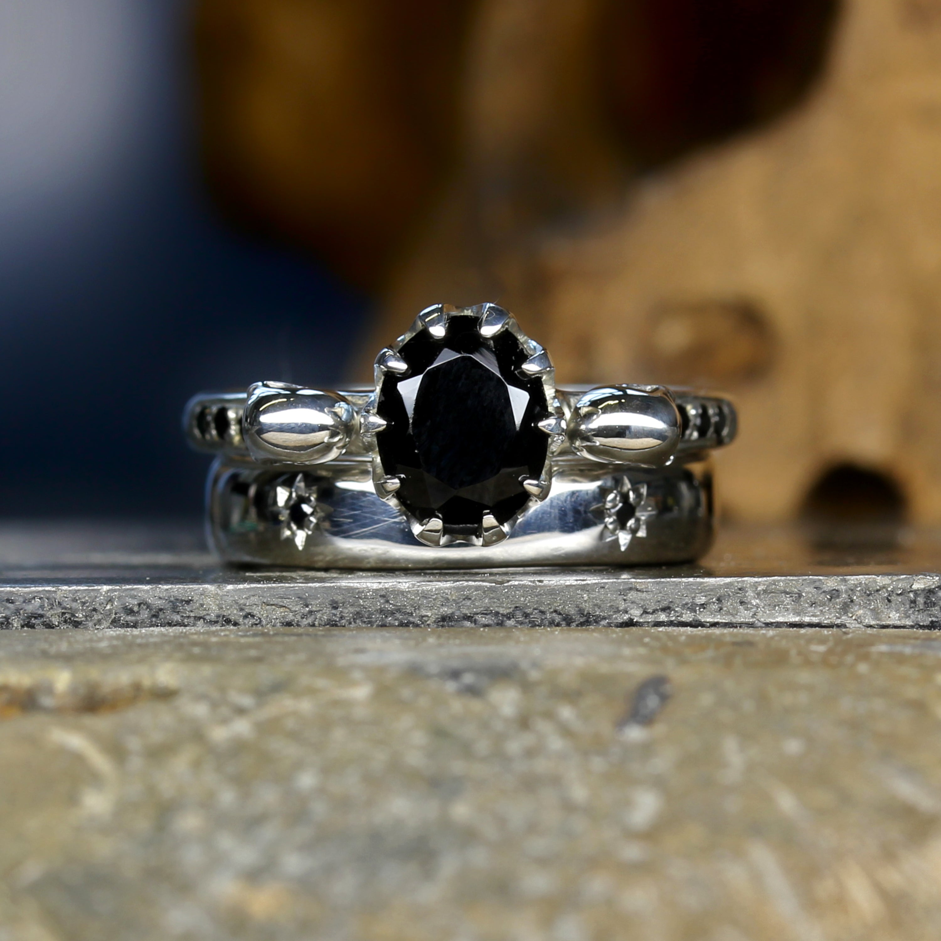 Black Oval Skull Engagement Ring paired with Silver Wedding Band