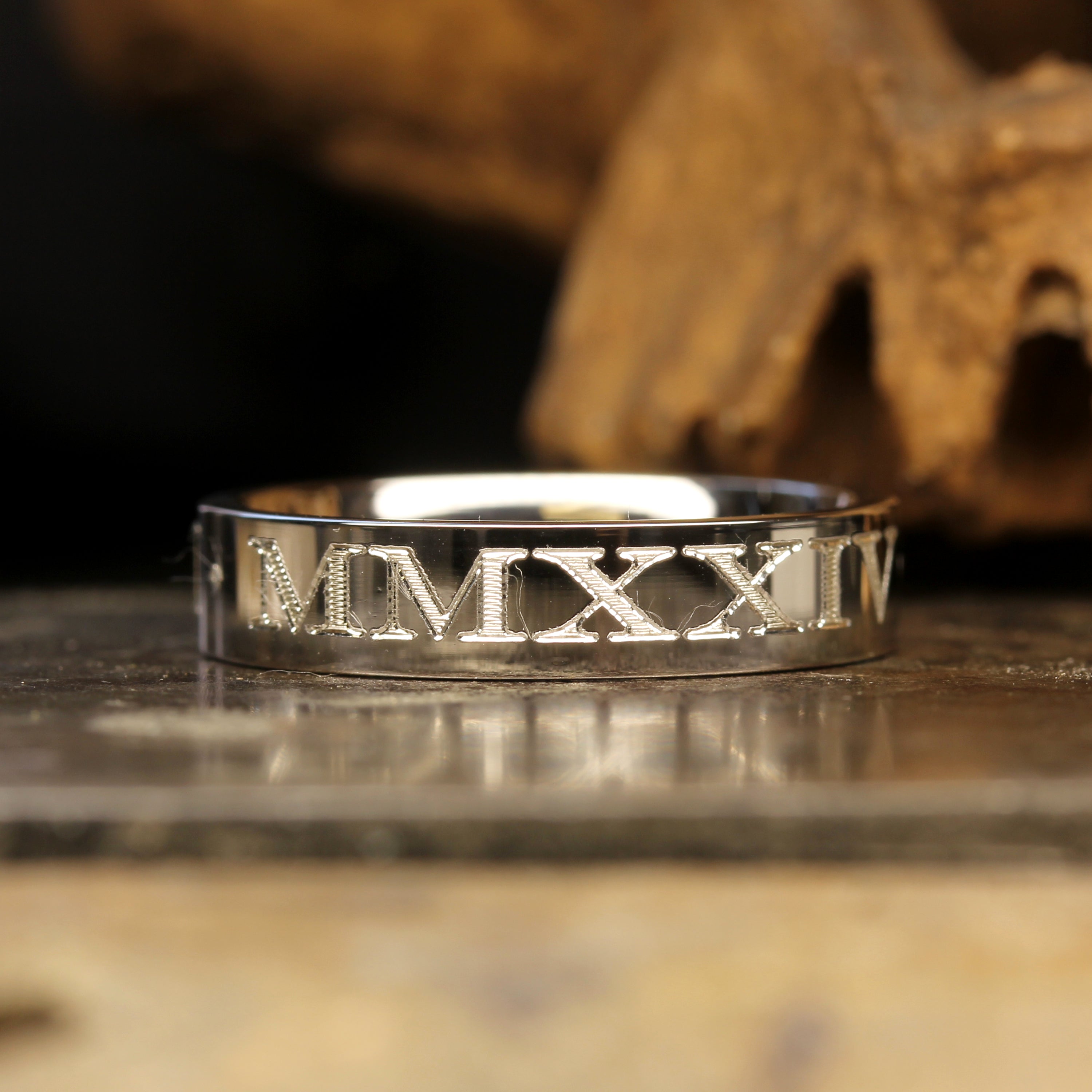 Roman Numeral Silver Wedding Ring, skull background