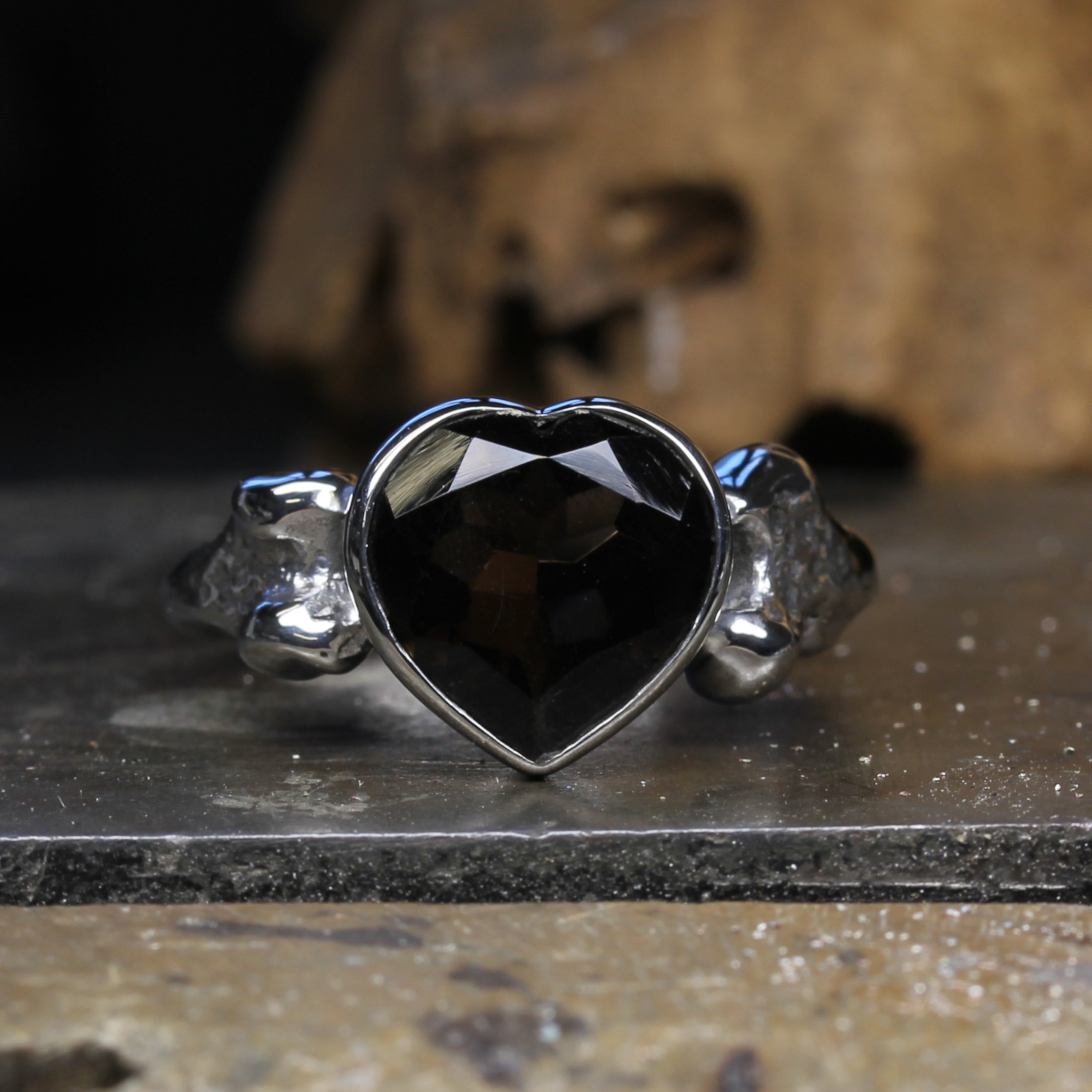 Smokey Quartz Heart Bone Ring on table