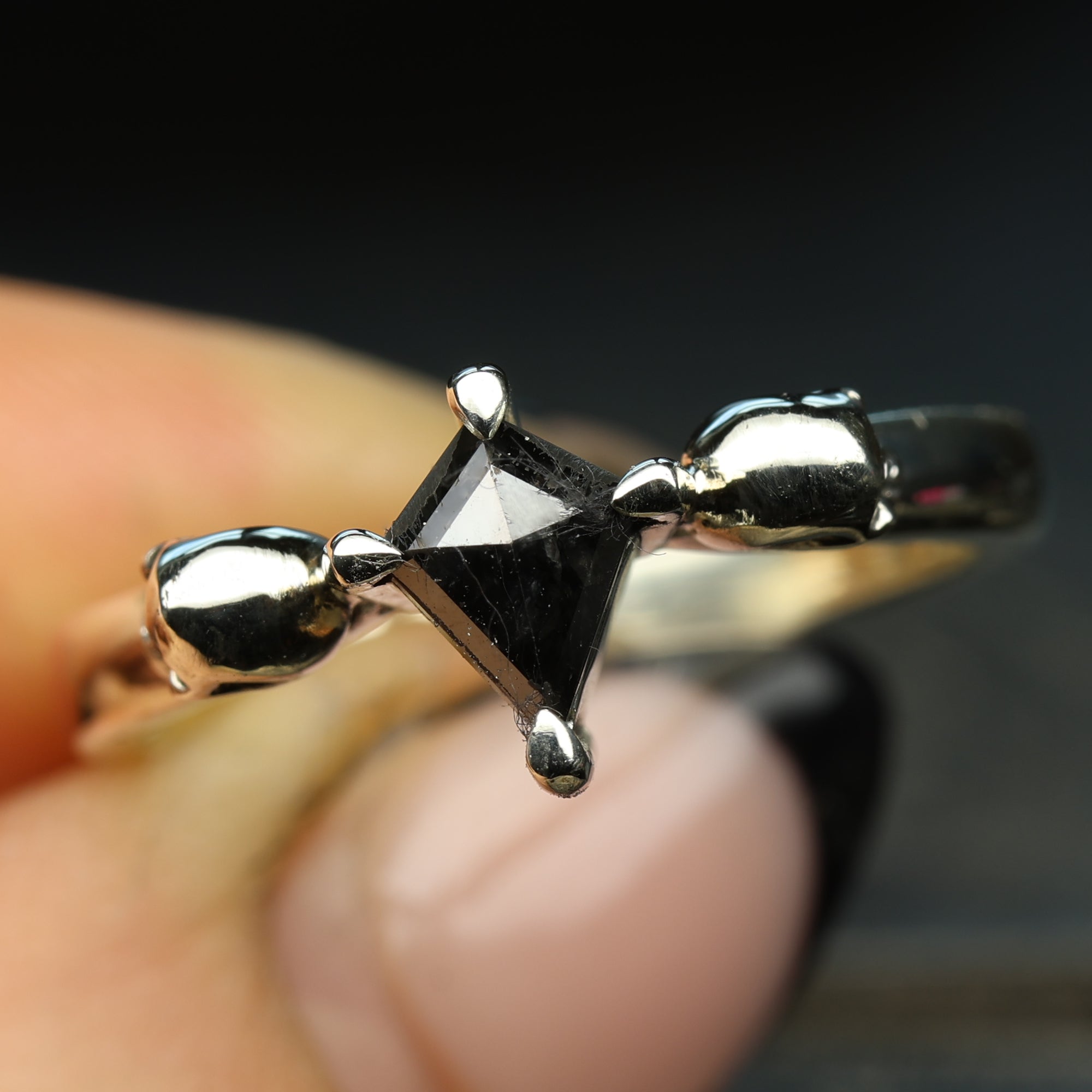 White gold skull engagement ring set with kite salt and pepper diamond