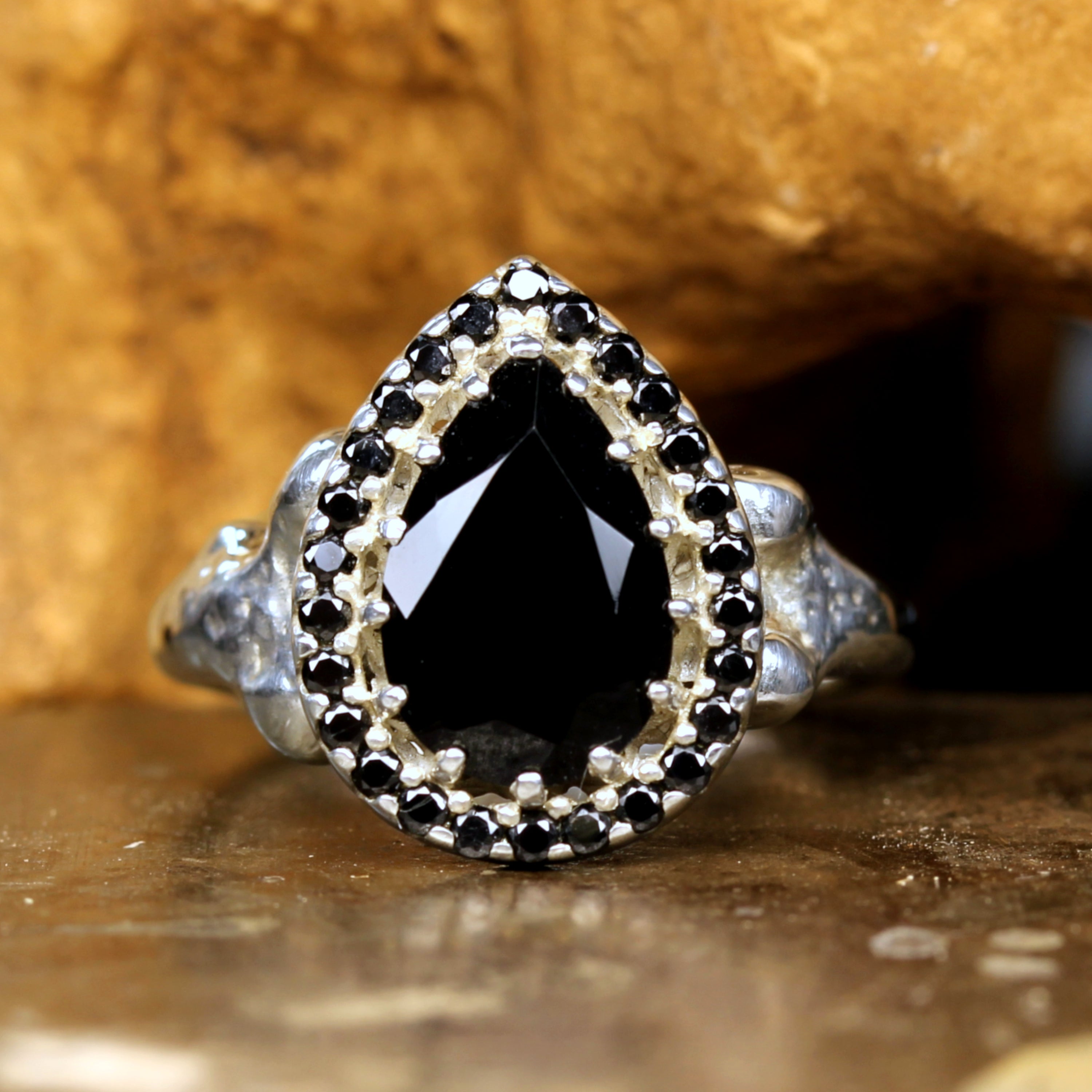 Pear-shaped Black Onyx with a Black Spinel Halo, set on Handcrafted Sterling Silver Bone ring.